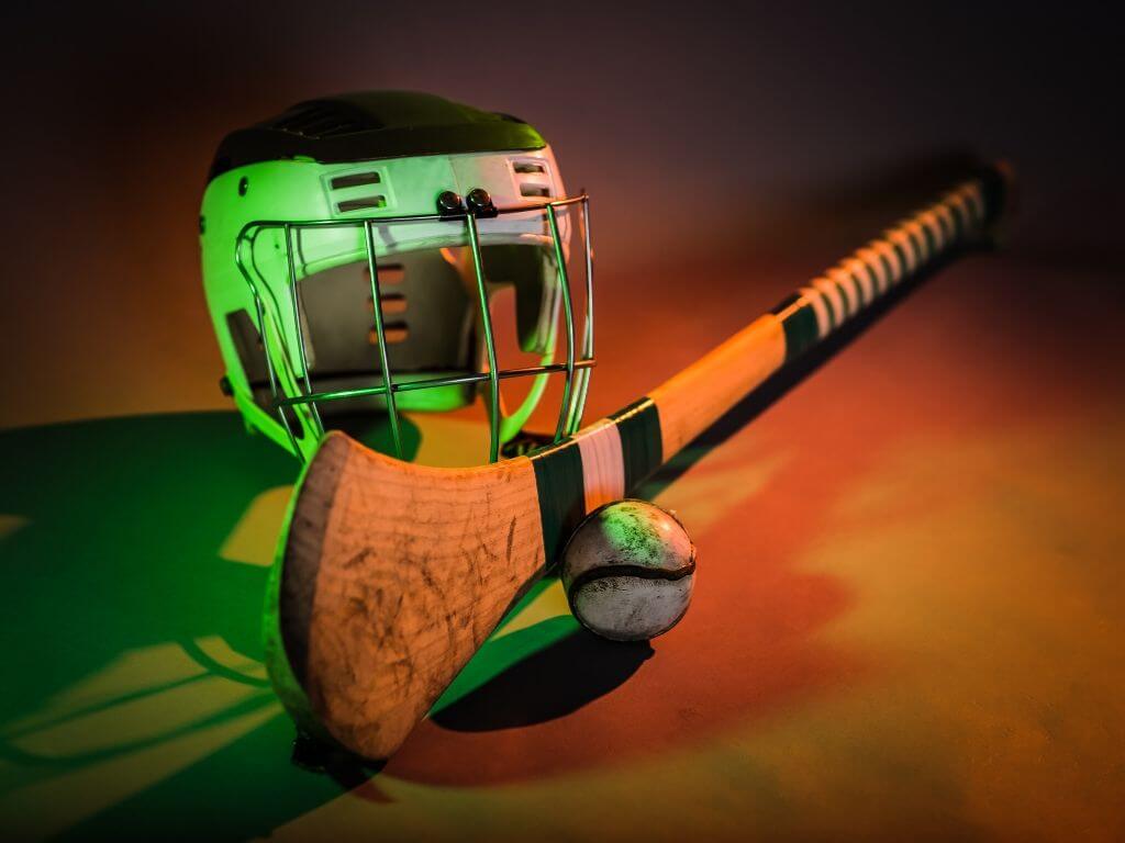 A picture of an Irish hurl (stick), the sliotar (ball) and helmet from an Irish hurley player