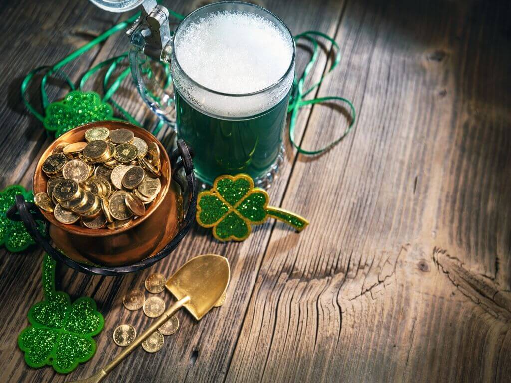 A picture of gold coins in a pot, shamrocks and a pretend pint of green guinness for St Patricks Day