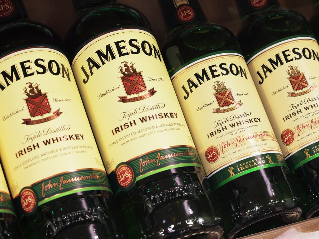 A picture of a line of Jameson Irish Whiskey bottles