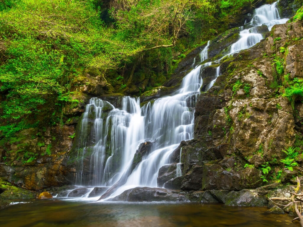 A picture of the stunning Torc Waterfall in Killarney National Park, one of the best places to visit in Ireland