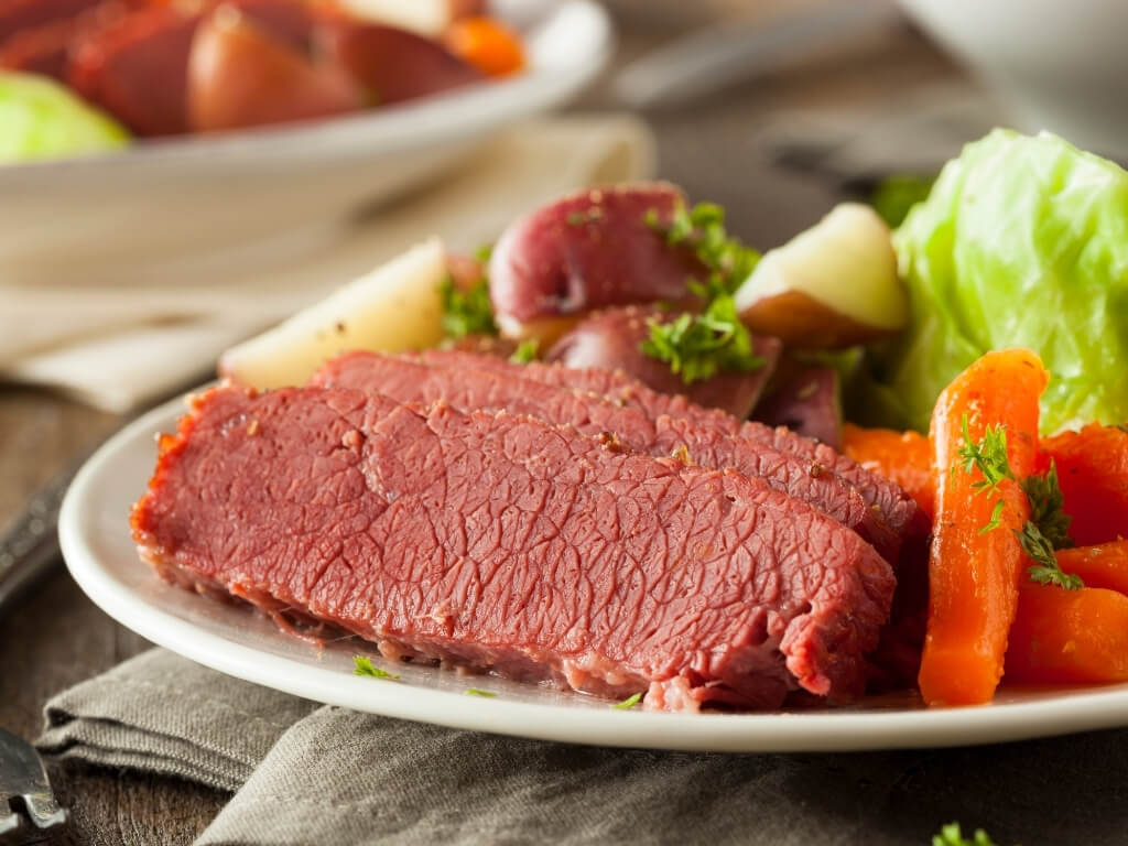 A picture of a plate containing Irish corned beef with vegetables