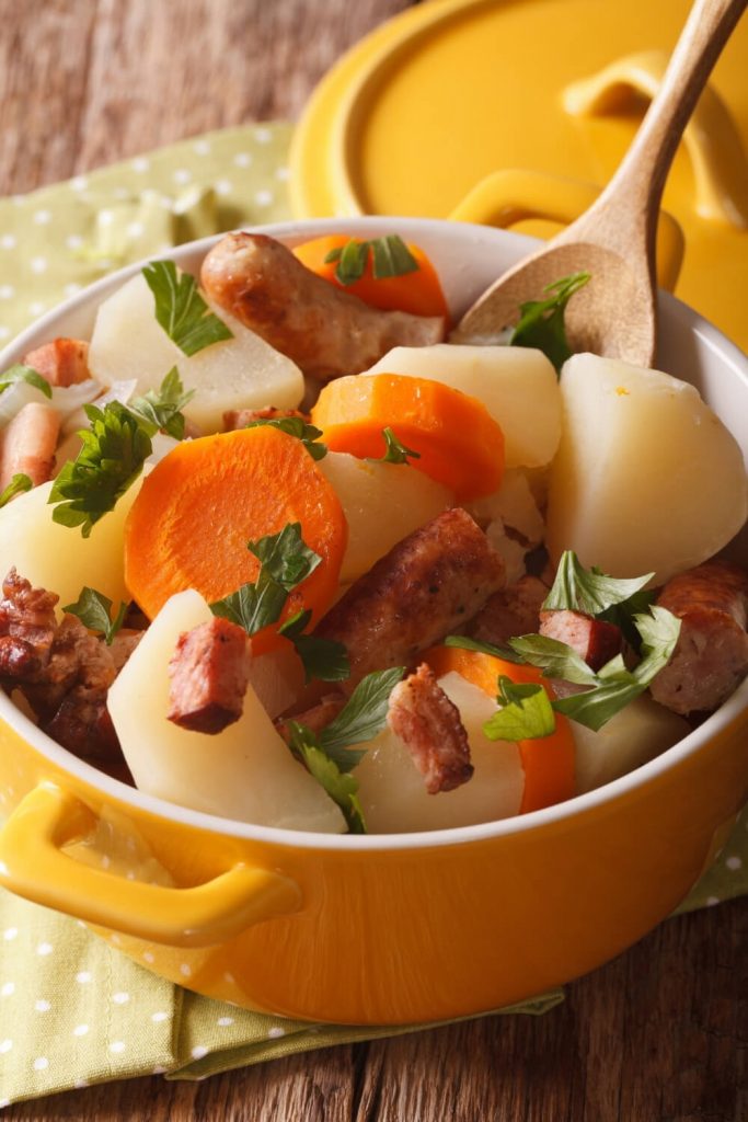 A picture of a Dublin Coddle, a traditional Irish dish made with sausages, rashers, potato, carrot and parsley