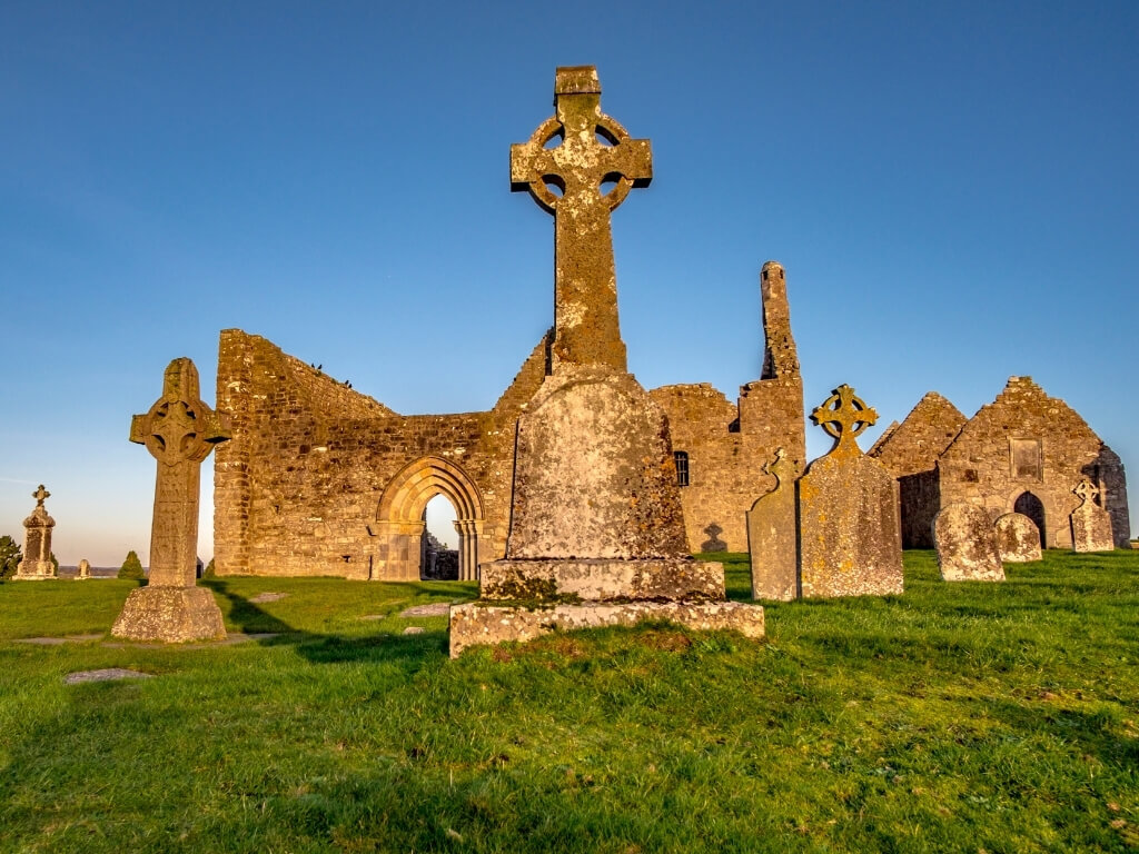 A picture of some of the high crosses and ruined monastic buildings at Clonmacnoise, Ireland