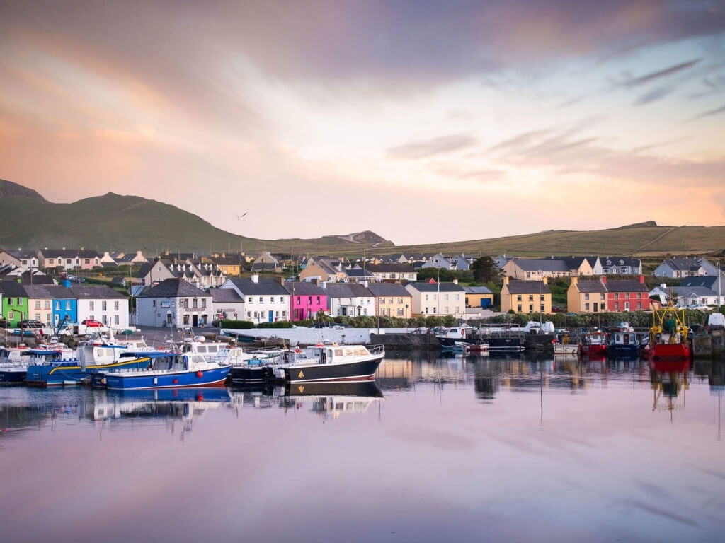 A picture of the harbour side at Portmagee, Kerry with colourful houses dotted in between white ones