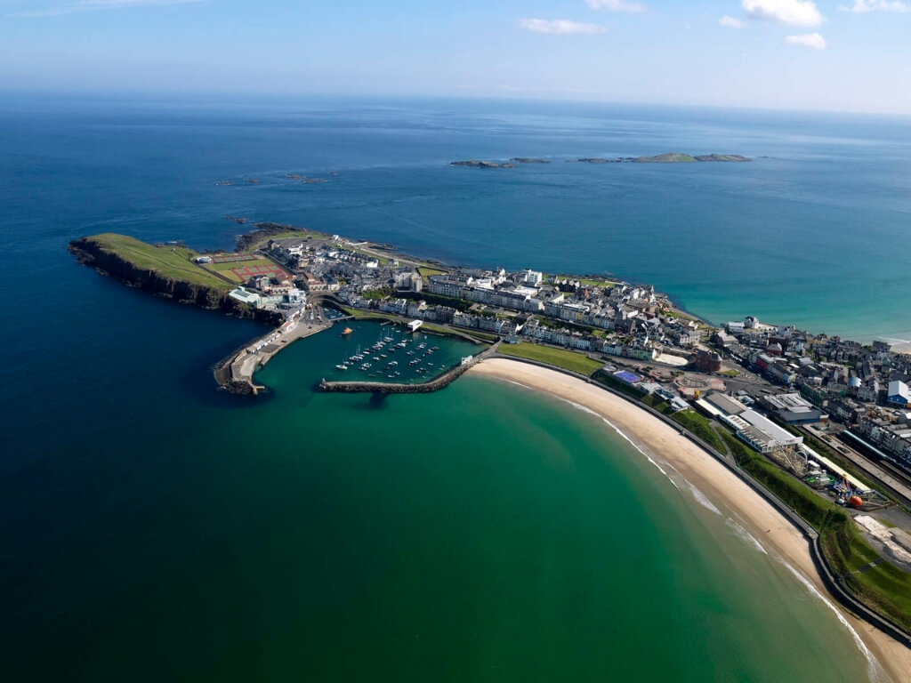 A picture of the sandy beach and marina of Portrush in County Armagh