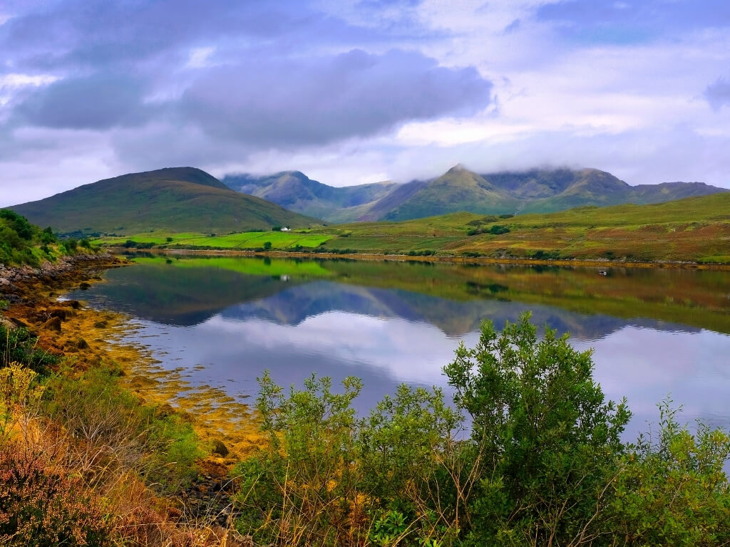 A picture of the still waters of Killary Harbour with mountains in the background