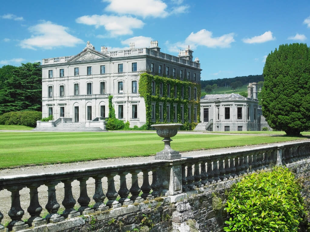 A picture of manicured lawns leading to the beautiful Curraghmore House in County Waterford