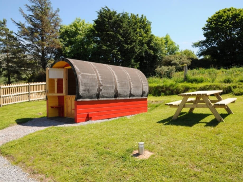 A picture of the red and black pod at Coach Field Glamping, Camp, Kerry