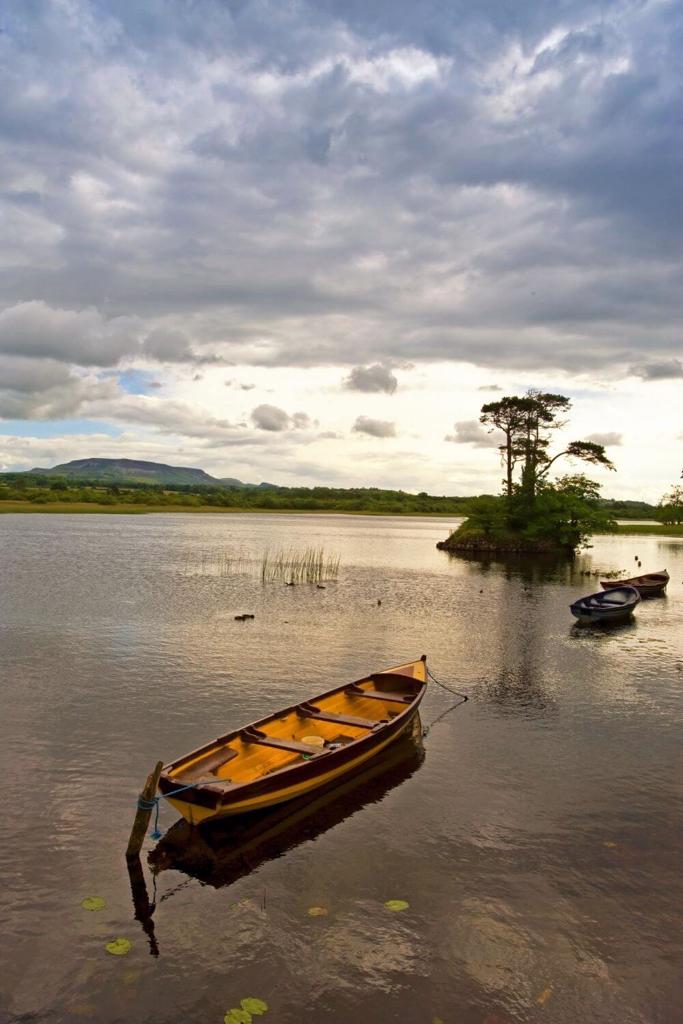 A picture of some small boats on Lough Gill in County Sligo, Ireland