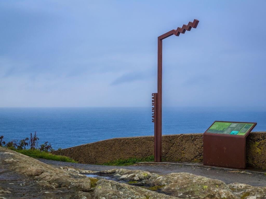 A picture of the Malin Head Signature Discovery Point in County Donegal, the start or endpoint of the Wild Atlantic Way in Ireland