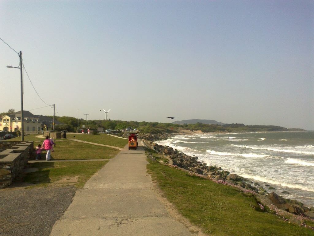 A picture of the promenade and small train approaching along it at Courtown, Wexford