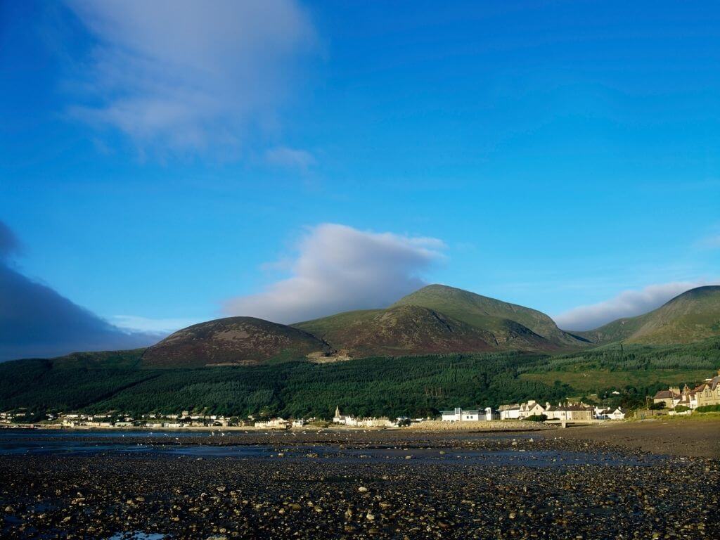 A picture of Newcastle, Down with the Mourne Mountains in the background