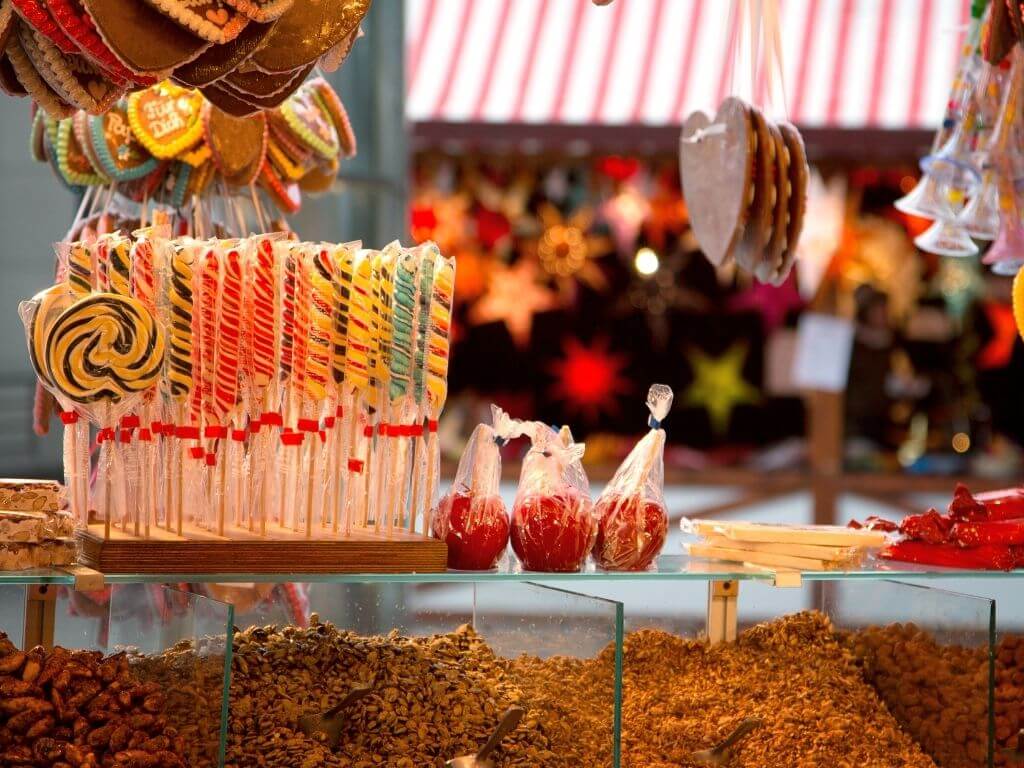Christmas market stall with candy and candy canes for sale