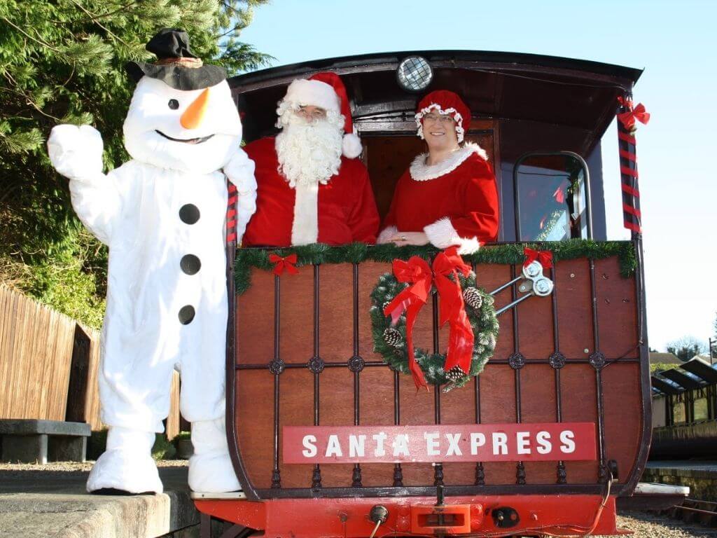 A picture of Santa, Mrs Claus and a Snowman on the Santa Express, Waterford Suir Valley Railway