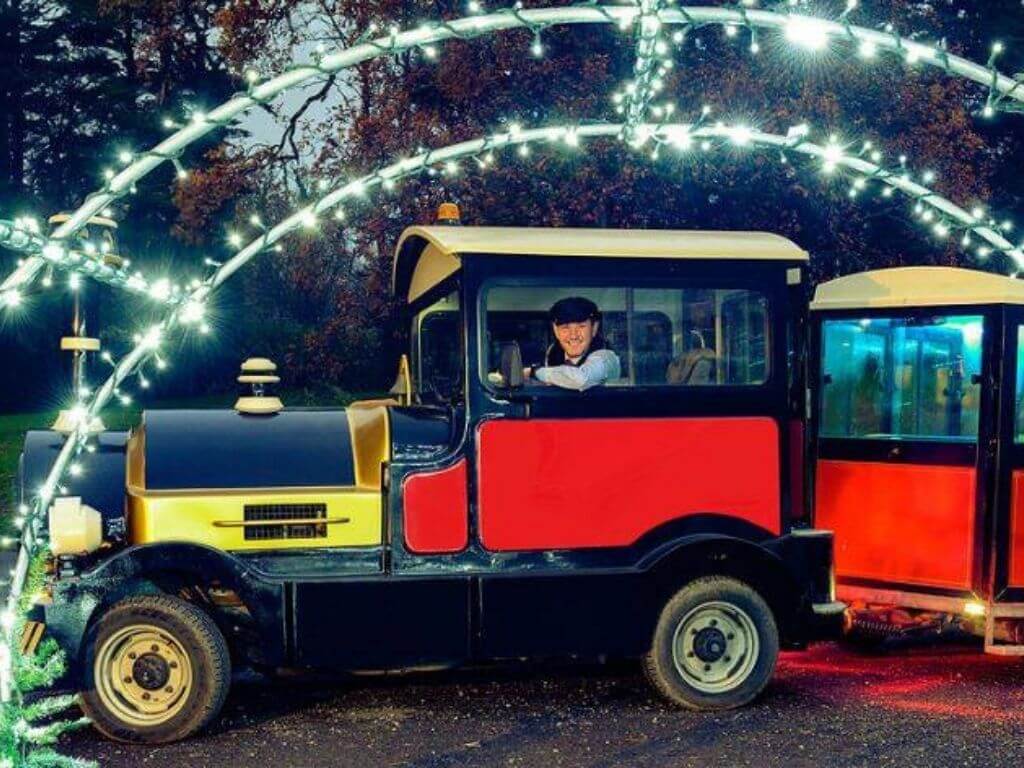 A picture of the front engine and half a carriage of the Westport House Santa Train