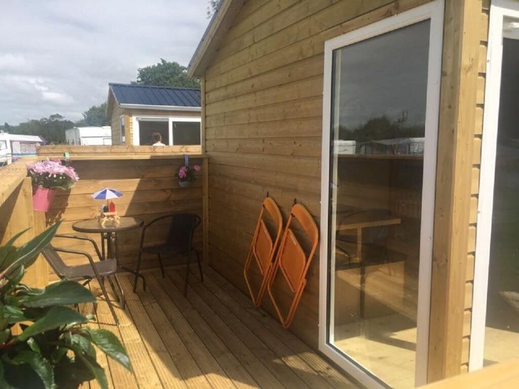 A picture of the deck area of one of the glamping cabins at Duncannon Beach Holiday Park