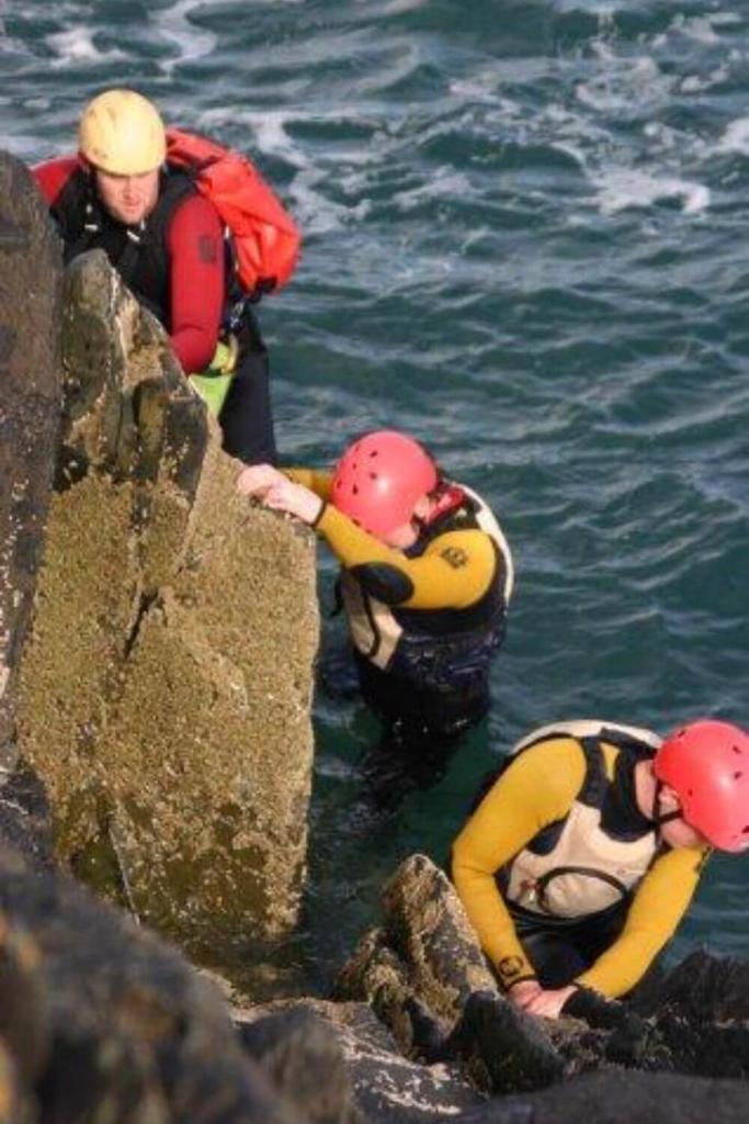 Some people taking part in a coasteering activity at Clearsky Adventure Centre