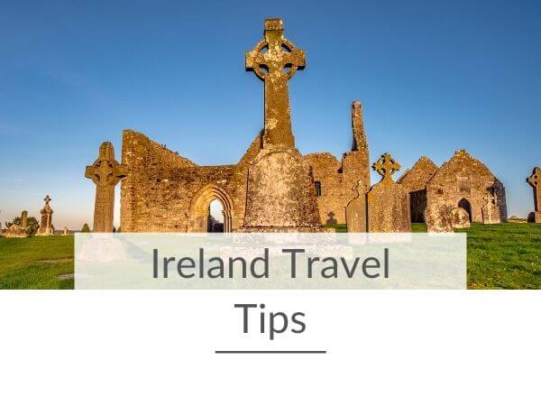 A picture of a ruined chapel and Celtic cross in front with text overlay saying Ireland travel tips