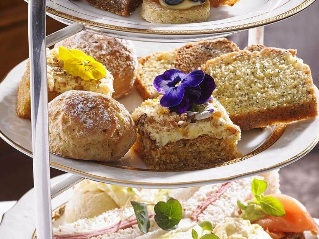 A close up of the tiered tray of the Hayfield Manor Hotel Afternoon Tea