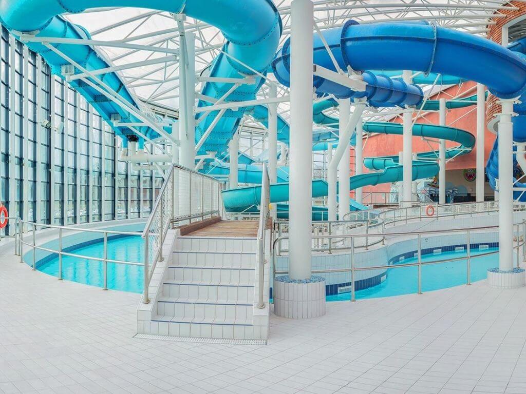 A picture of some of the water slides and lazy river at Aquazone, National Aquatic Centre