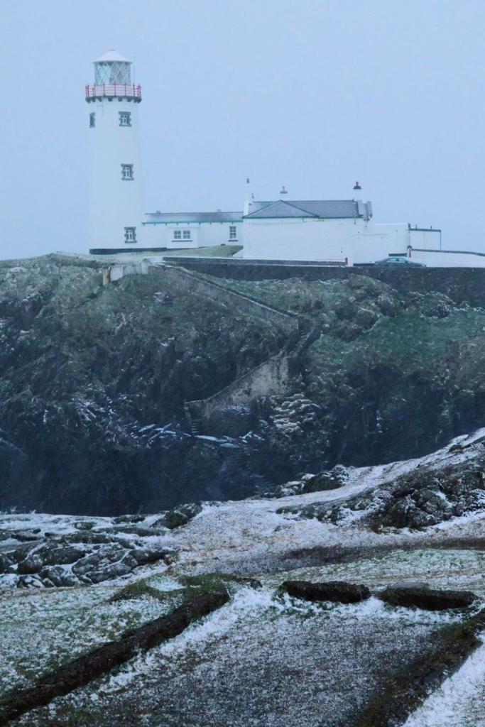 A picture of a winter scene which include the Fanad Lighthouse, Donegal