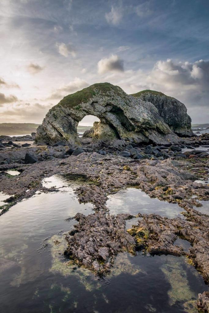 Rockpools at Ballintoy, Northern Ireland with blue skies overhead