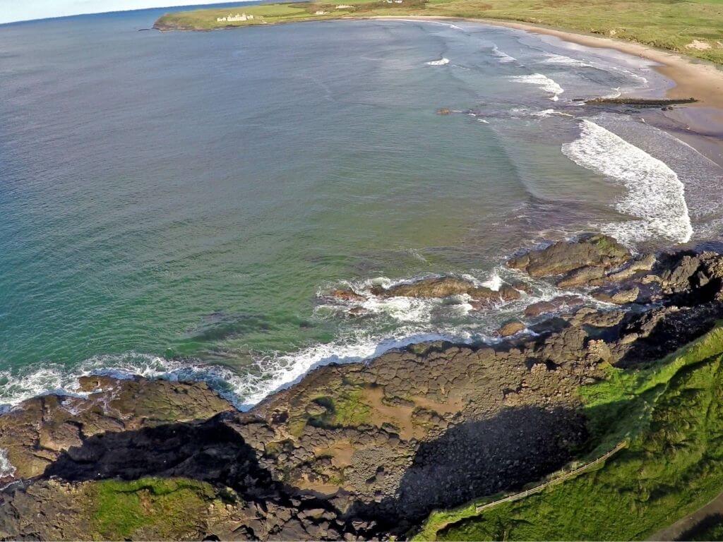 A picture of Portballintrae Beach and some of its rockpools