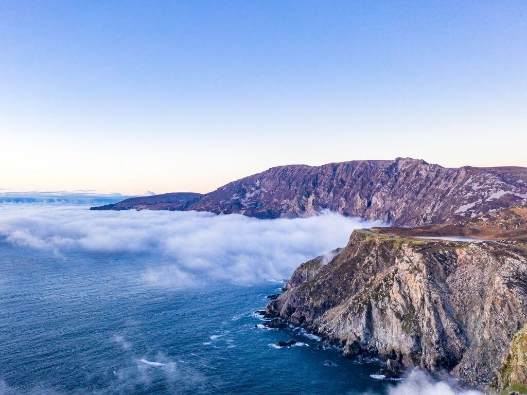 A picture of low cloud over the sea at the edge of the sea cliffs of Slieve League in County Donegal