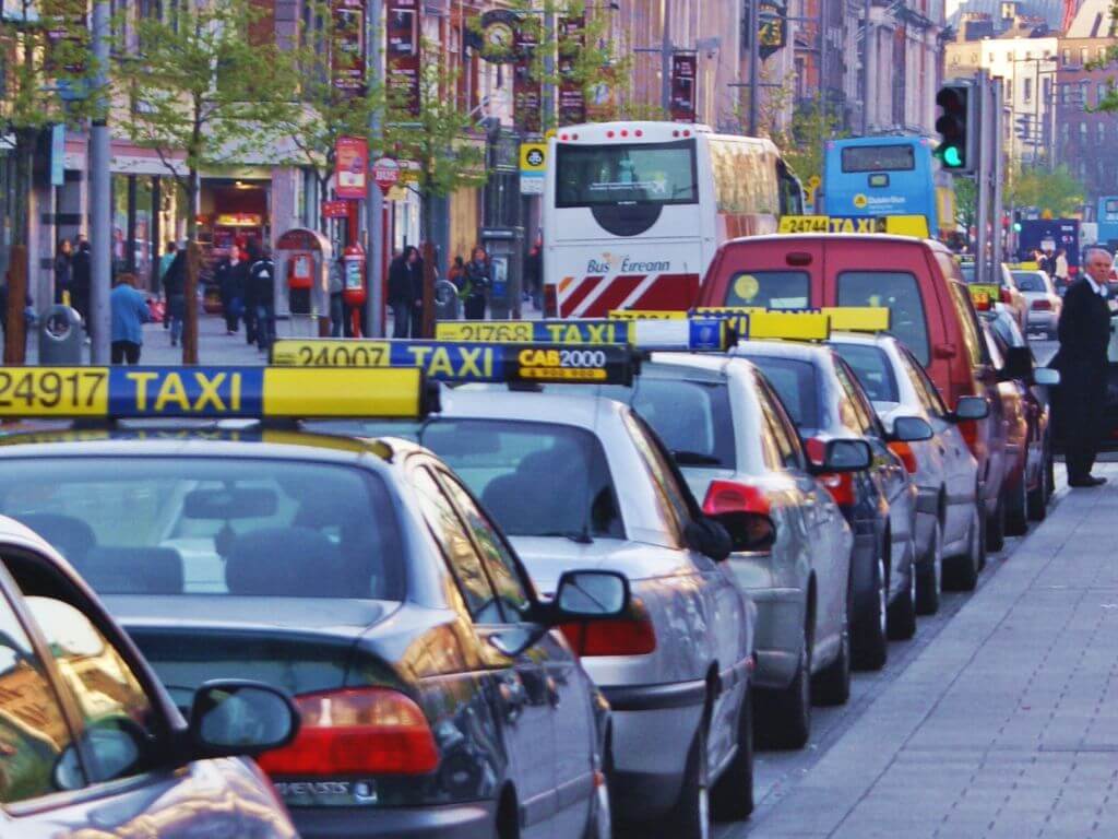A picture of a line of taxis in the Dublin Taxi rank in O'Connell Street