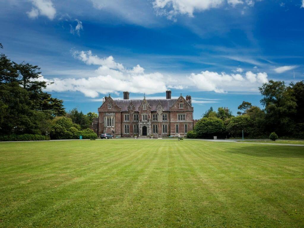 A picture of Wells House and Gardens, Wexford with manicured lawns leading up to the house