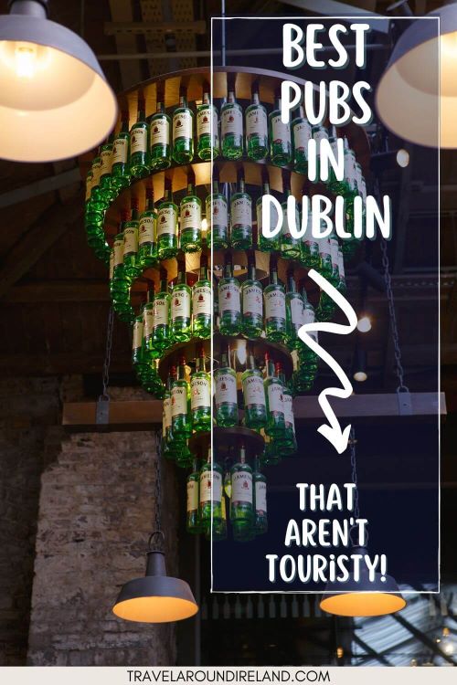 A picture of a chandelier in a pub made from bottles of Jameson whiskey and text overlay saying best pubs in Dublin that aren't touristy