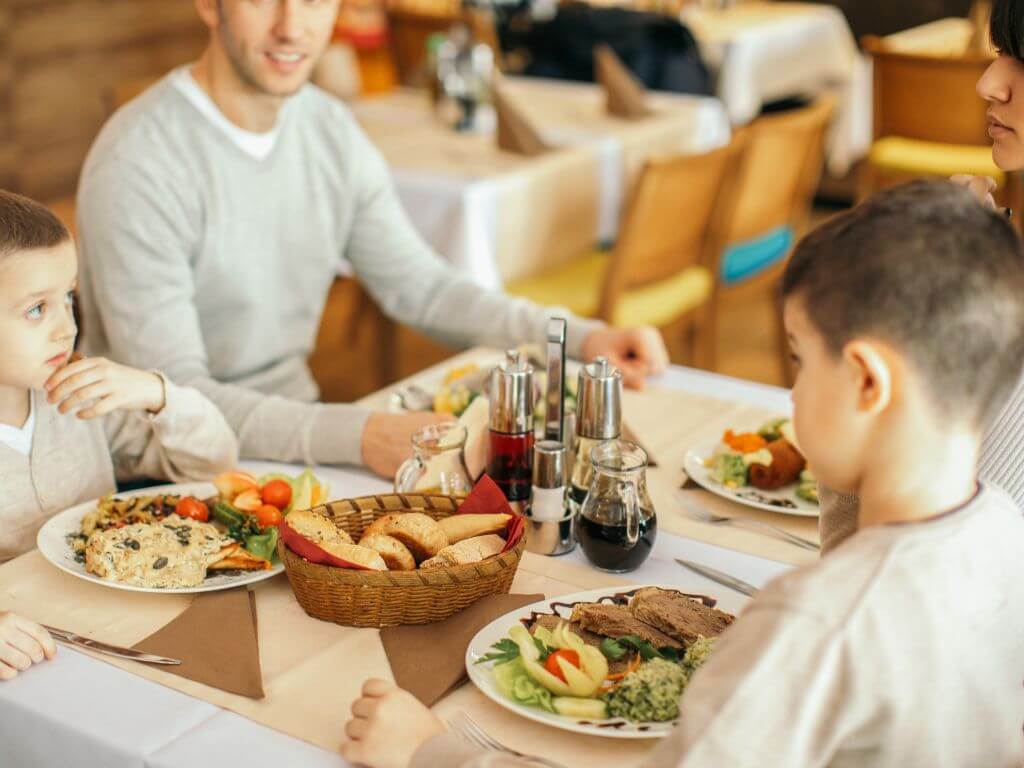 A family enjoying a meal in a restaurant