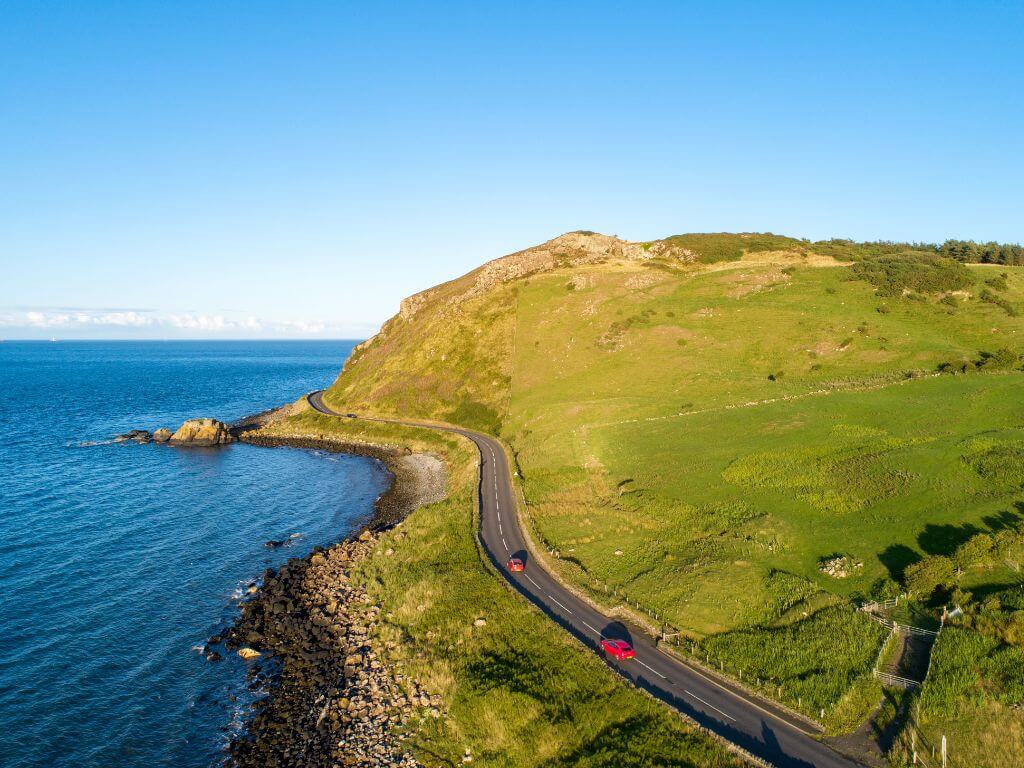 An aerial picture of part of the Causeway Coastal Route in Northern Ireland, one of the best driving roads in Ireland
