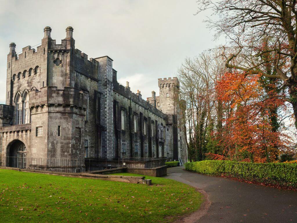 A picture of a path around Kilkenny Castle in autumn
