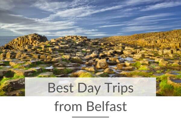 A picture of the Giant's Causeway and text overlay saying best day trips from Belfast