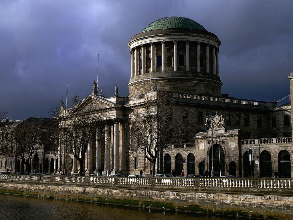 A picture of the Four Courts in Dublin with the River Liffey in front