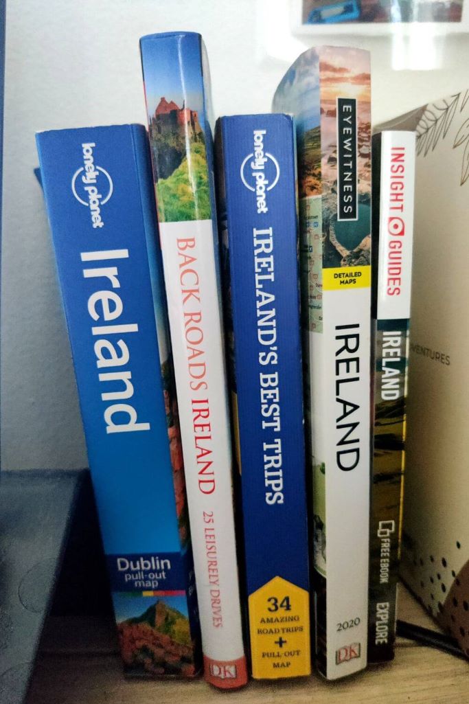 A picture of several Ireland travel guidebooks sitting on a desk