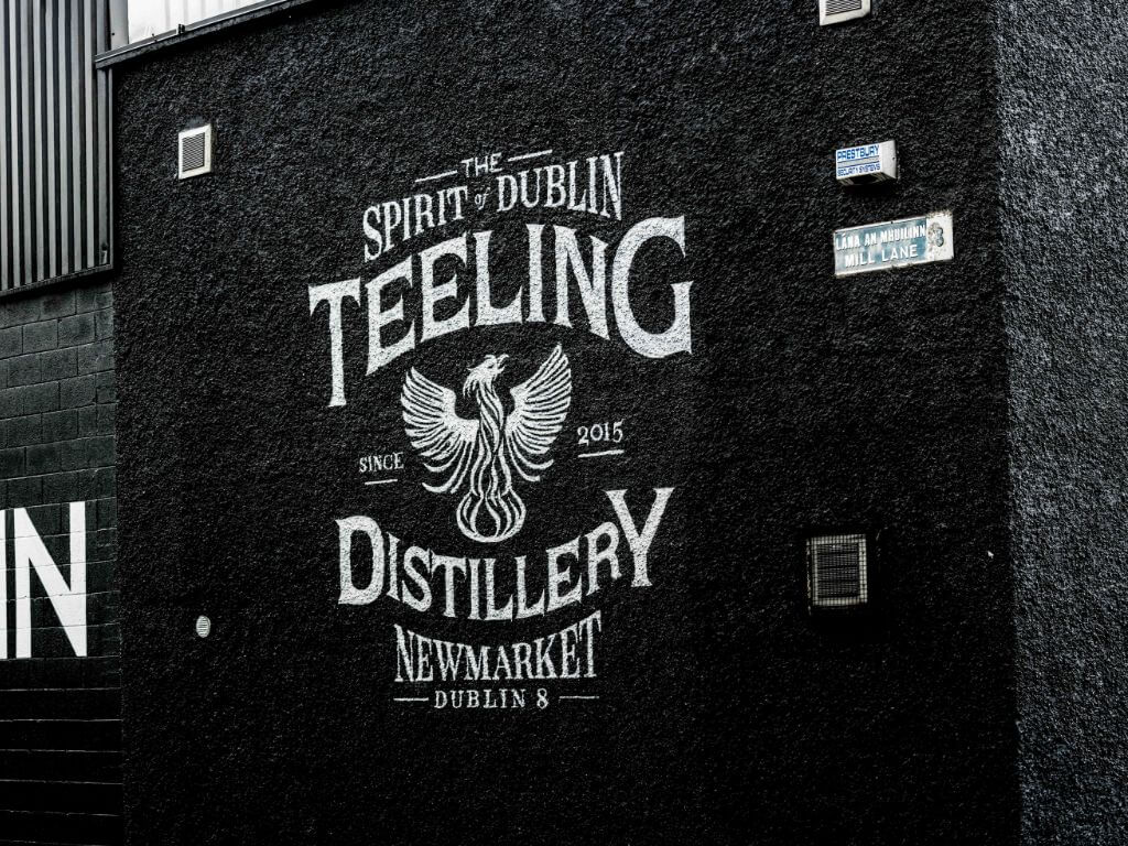A picture of the black and white Teeling Distillery name board