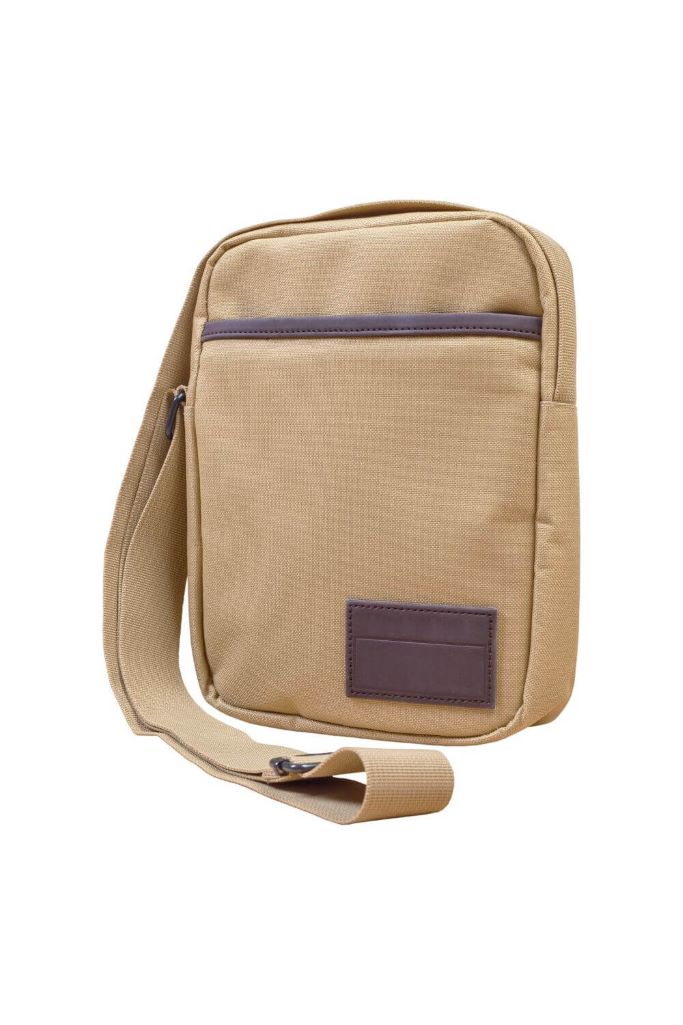 A picture of a beige cross-body bag with dark brown trim against a white background