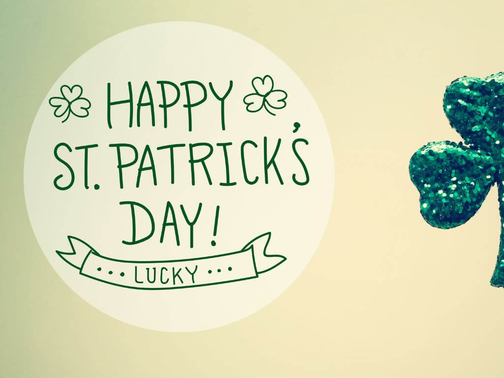 A graphic saying Happy St Patricks Day and featuring a sparkly green shamrock