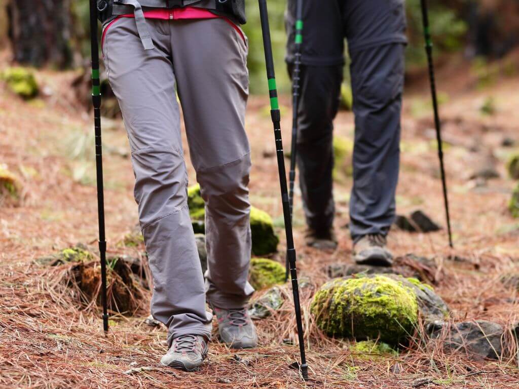 A picture of the bottom half ot two hikers wearing technical pants and hiking shoes or boots