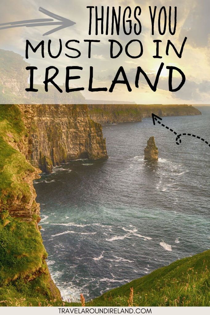 A picture of the Cliffs of Moher with green grass on top and white waves crashing beneath and text overlay saying things you must do in Ireland