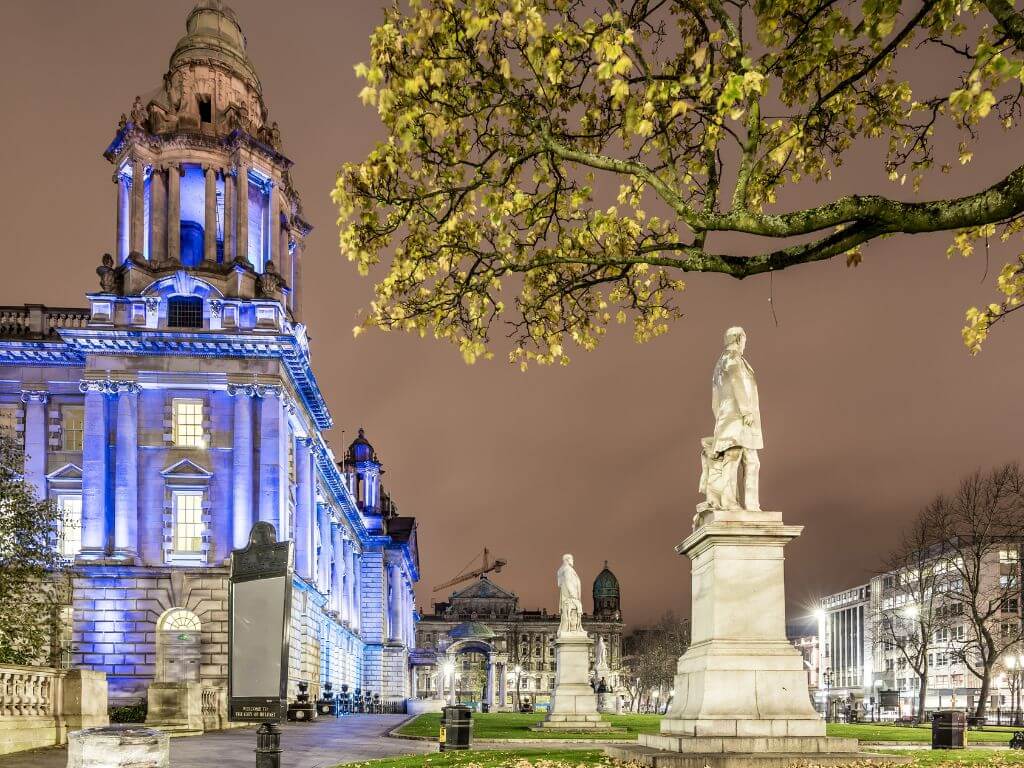A picture of Belfast City Hall illuminated by night