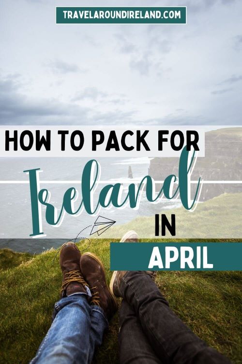 A picture of two sets of legs and hiking boots sitting on a grassy bank at the edge of a cliff and text overlay saying how to pack for Ireland in April