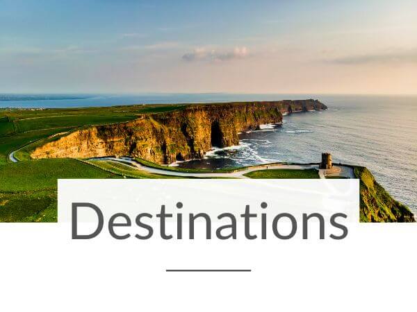 An aerial shot over O'Brien's Tower at the Cliffs of Moher in Ireland and text overlay underneath saying Destinations