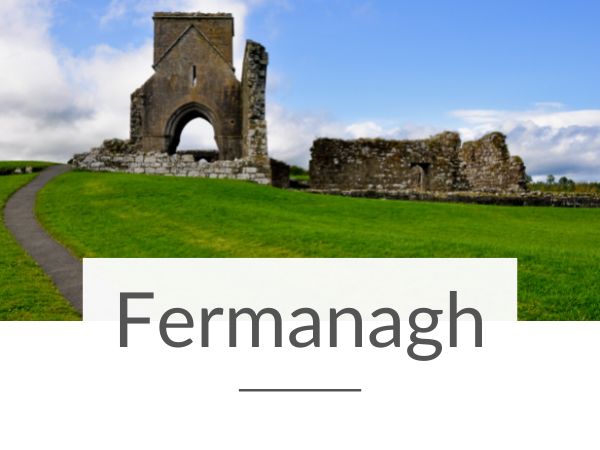 A picture of Devenish Island Monastic Site in County Fermanagh and text overlay underneath saying Fermanagh