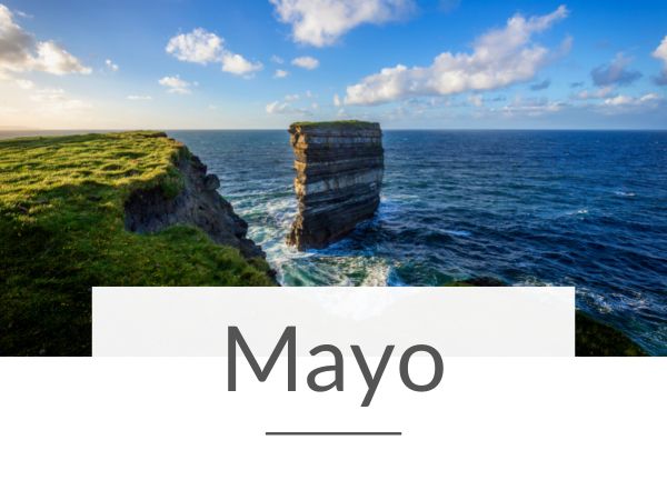 A picture of Downpatrick Head in County Mayo and text overlay underneath saying Mayo