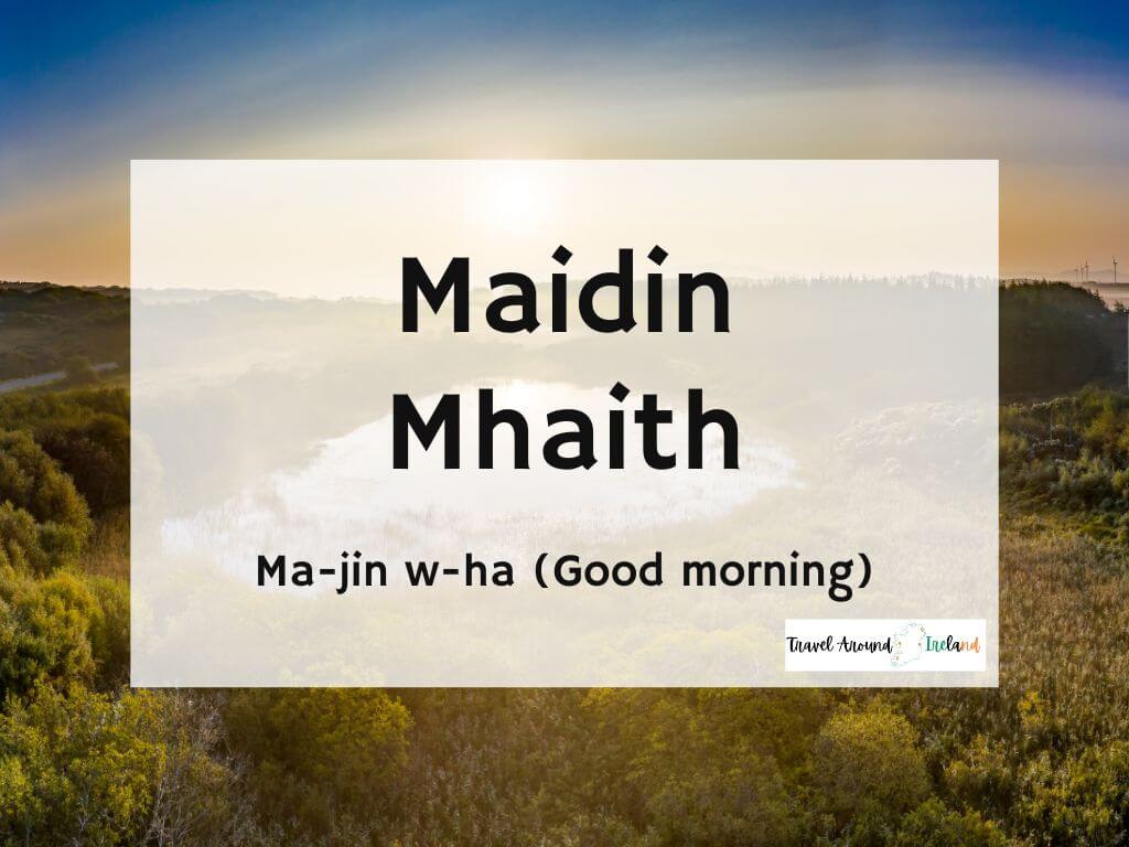 A picture of a sunrise and text overlay saying Maidin mhaith