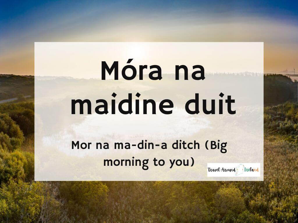A picture of a sunrise and text overlay saying Móra na maidine duit