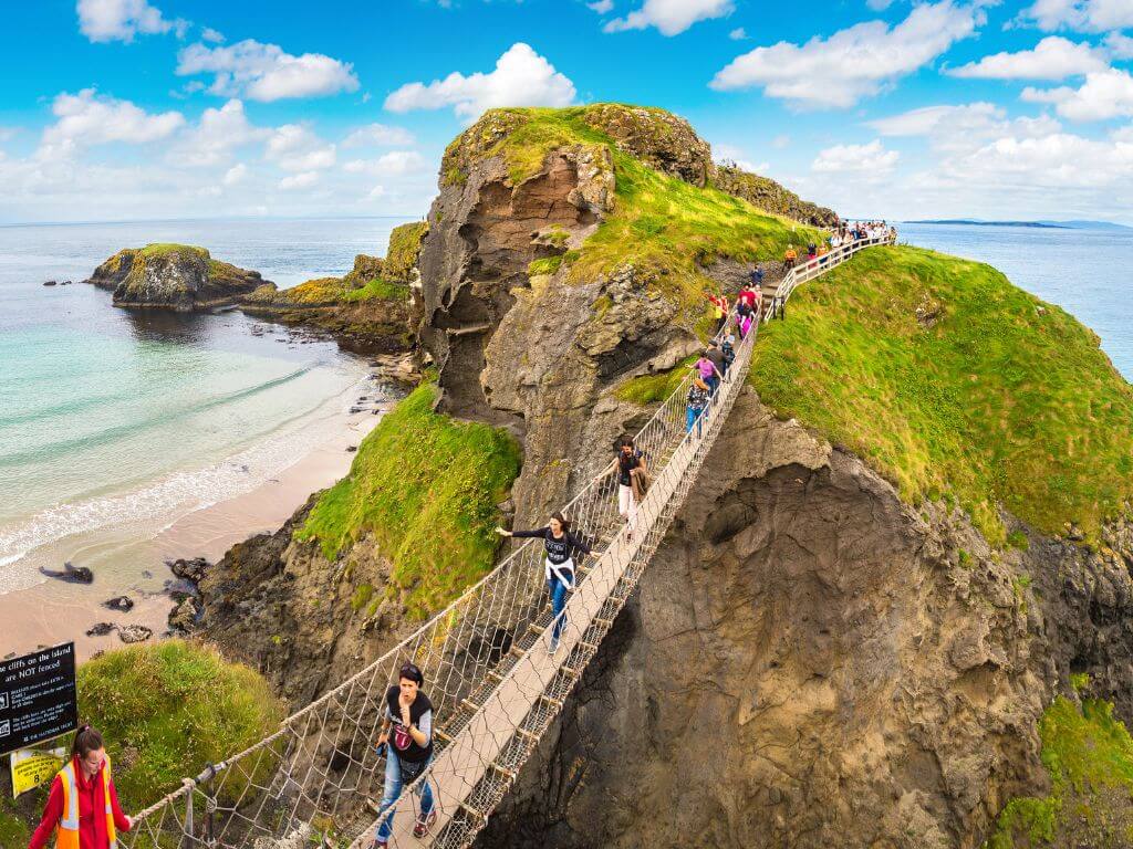 A picture of people crossing the Carrick-a-Rede Bridge